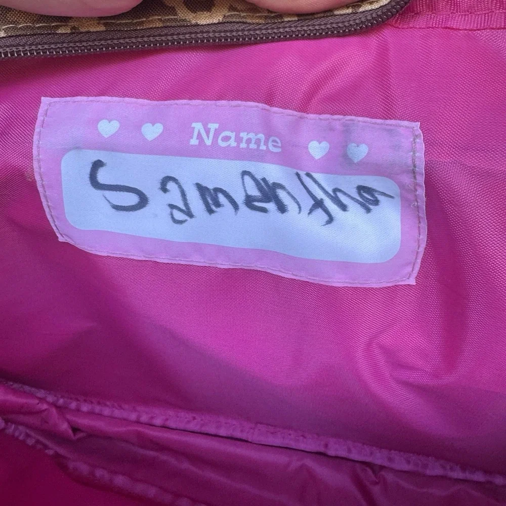 Sanrio Hello Kitty messenger bag with a leopard print pattern and pink trim